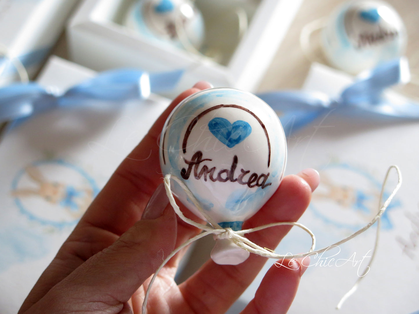 Small, rounded christening balloon favor set with name