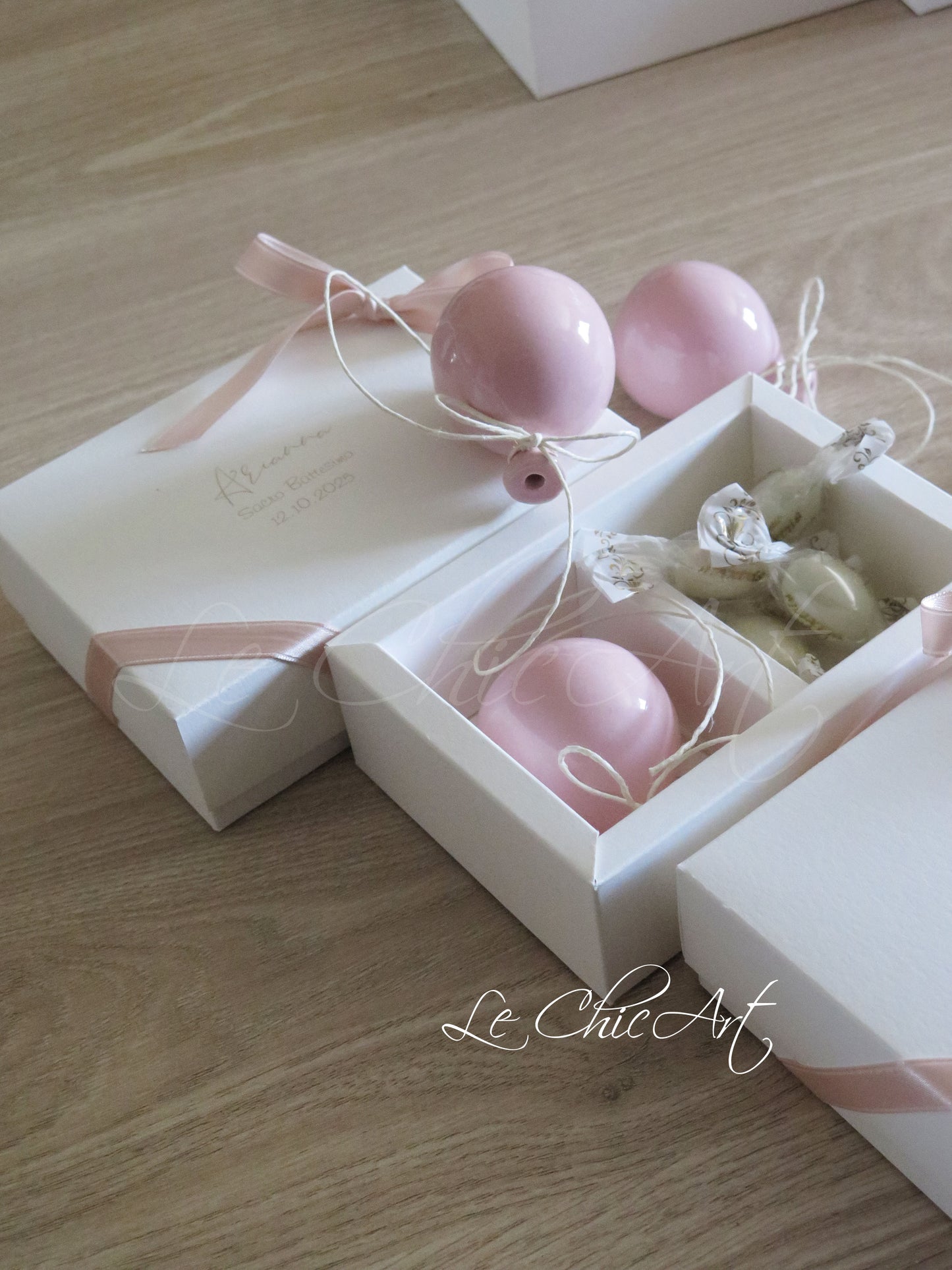 Small, rounded christening balloon favor set with name