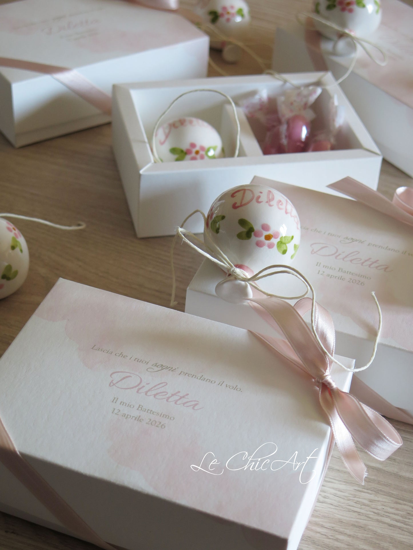 Small, rounded christening balloon favor set with name
