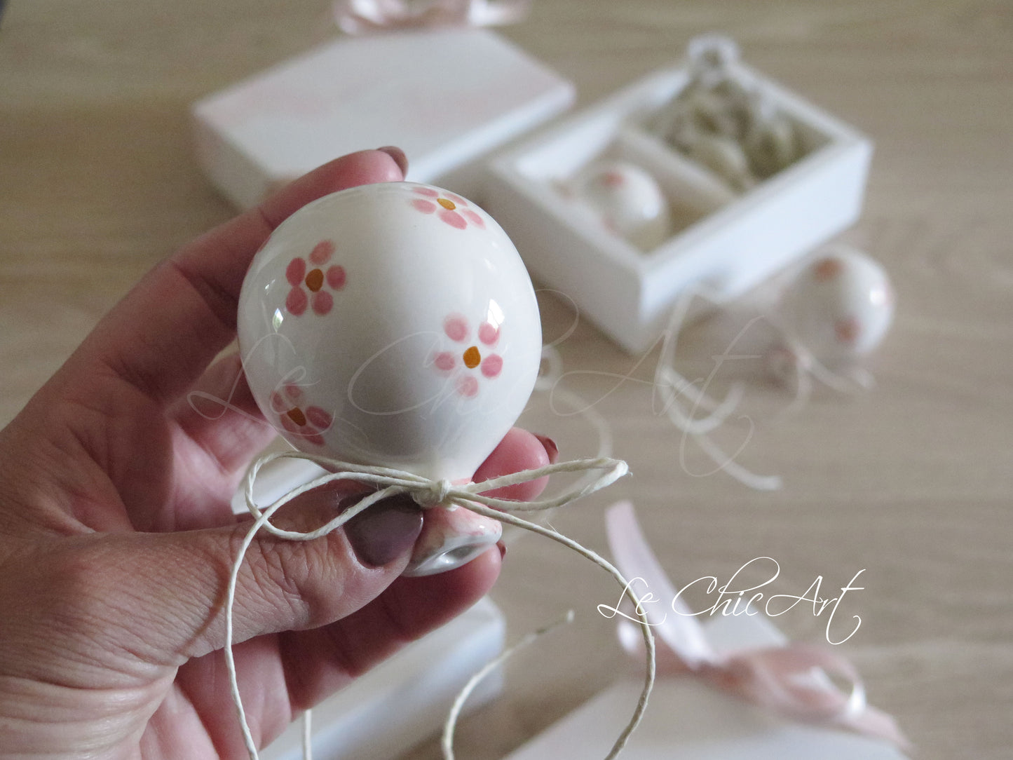 Small, rounded christening balloon favor set with name