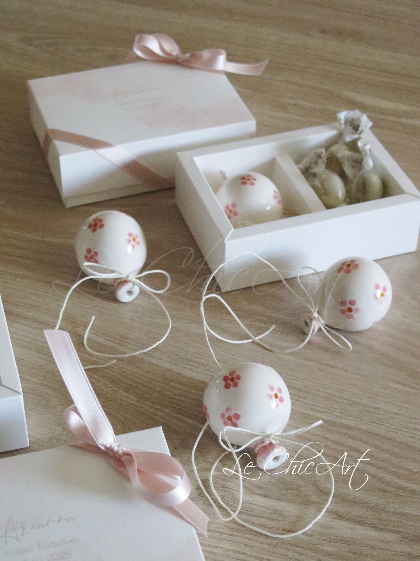 Small, rounded christening balloon favor set with name